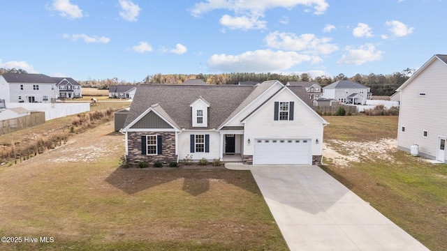 view of front of house with a front yard and a garage