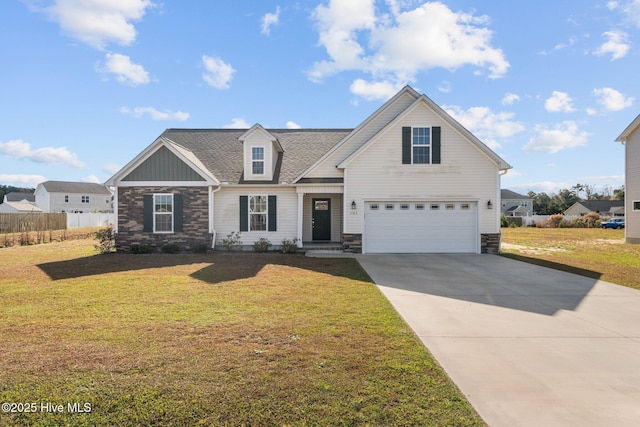 view of front of home featuring a front yard and a garage