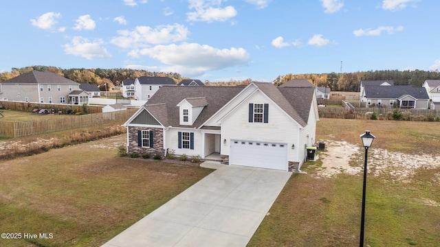 view of front of property with a front yard, cooling unit, and a garage