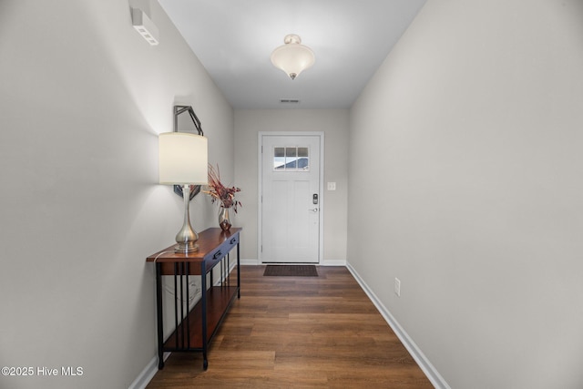 doorway with dark hardwood / wood-style floors