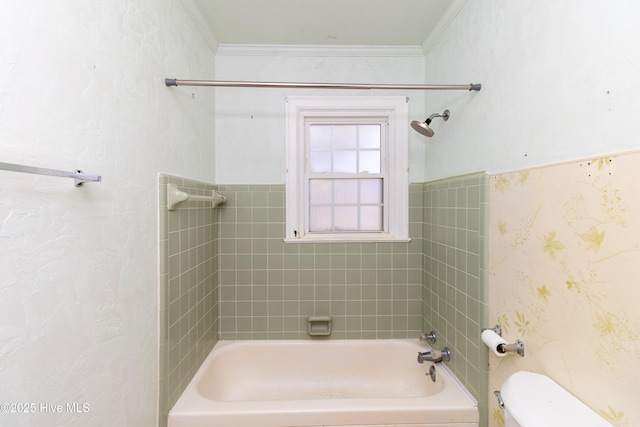 bathroom with crown molding, tiled shower / bath combo, and toilet