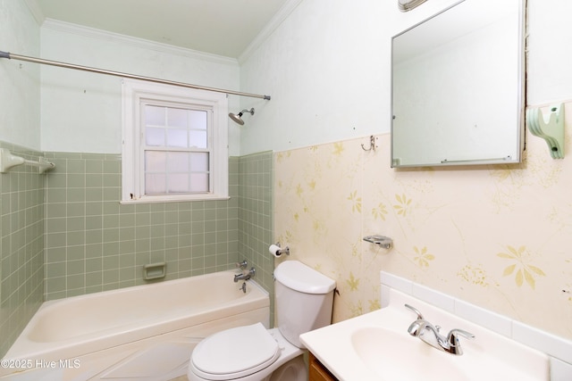 full bathroom with vanity, toilet, tiled shower / bath, and ornamental molding