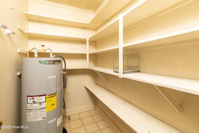 utility room featuring electric water heater