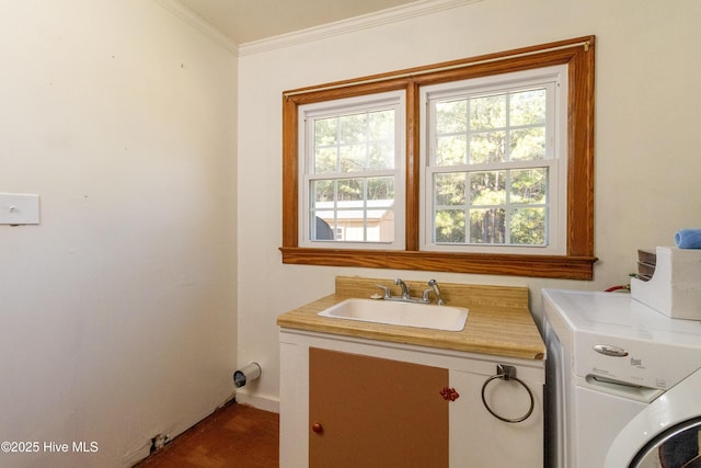 washroom featuring washer / dryer, ornamental molding, and sink