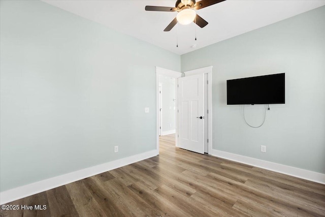 unfurnished bedroom featuring ceiling fan and wood-type flooring