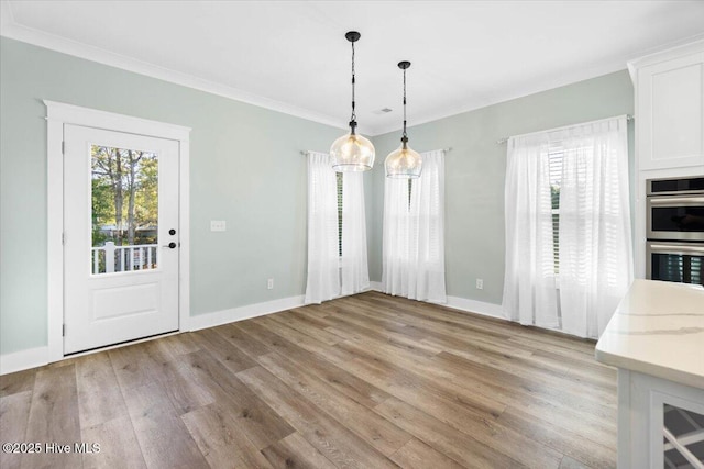 unfurnished dining area featuring light hardwood / wood-style flooring