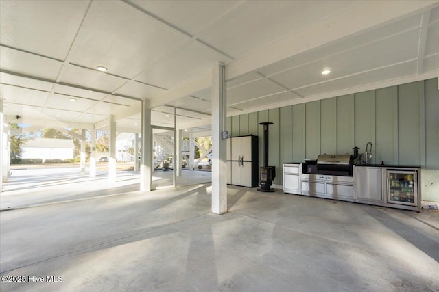 garage with white fridge and wine cooler