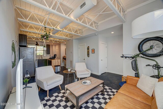 bedroom with light hardwood / wood-style flooring, a raised ceiling, and ceiling fan