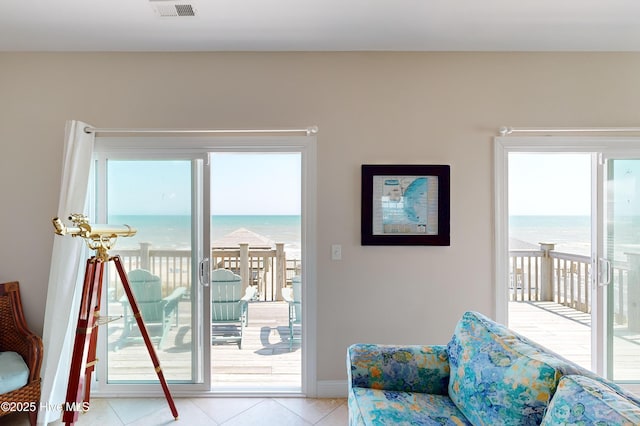 1280 New River Inlet Rd, North Topsail Beach, NC 28460 - entryway featuring healthy amount of natural light, light tile patterned flooring, and a water view