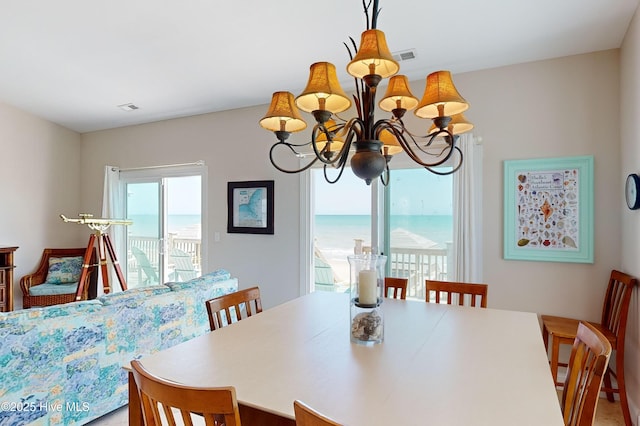 1280 New River Inlet Rd, North Topsail Beach, NC 28460 - dining room featuring a chandelier