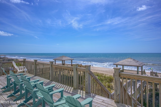 water view featuring a beach view and a gazebo