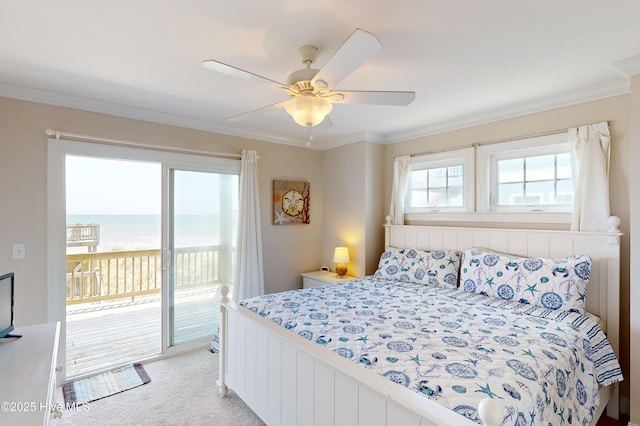 carpeted bedroom featuring access to exterior, a water view, ceiling fan, and ornamental molding