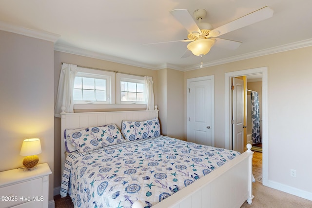 carpeted bedroom with ceiling fan, crown molding, and a closet