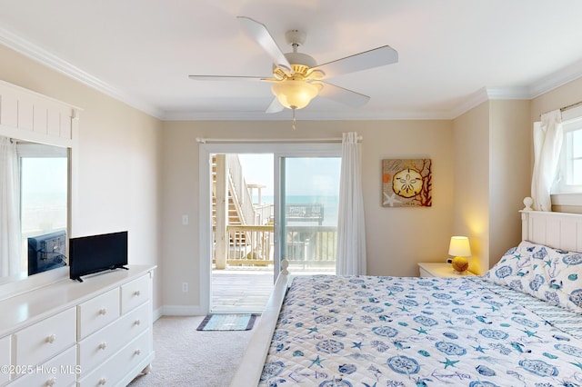 carpeted bedroom with access to exterior, multiple windows, ceiling fan, and crown molding