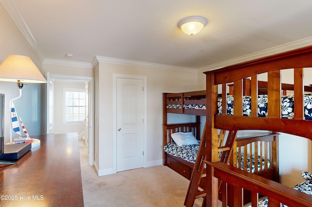 carpeted bedroom featuring ornamental molding