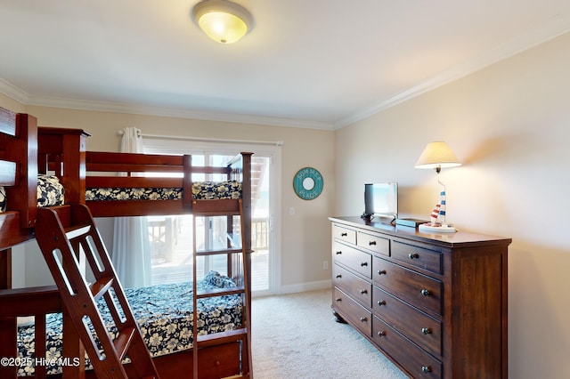 1280 New River Inlet Rd, North Topsail Beach, NC 28460 - bedroom featuring ornamental molding, light carpet, and access to exterior