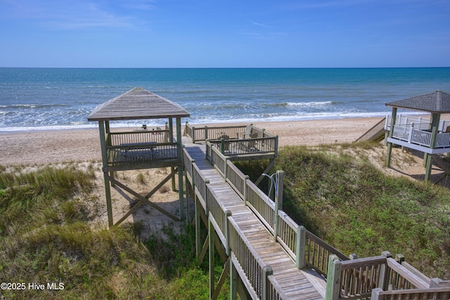 water view featuring a beach view and a gazebo