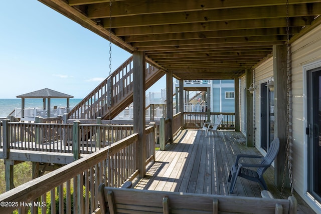 wooden terrace with a water view