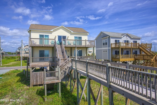 1280 New River Inlet Rd, North Topsail Beach, NC 28460 - rear view of house featuring stairs, a deck, and a shingled roof