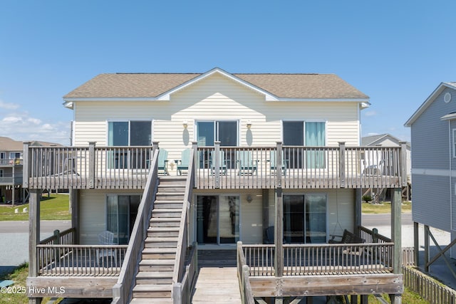 1280 New River Inlet Rd, North Topsail Beach, NC 28460 - back of house with a shingled roof, a wooden deck, and stairs