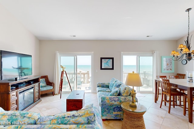 1280 New River Inlet Rd, North Topsail Beach, NC 28460 - living area featuring a chandelier and light tile patterned flooring