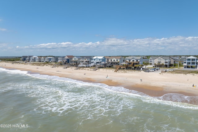 bird's eye view featuring a beach view and a water view