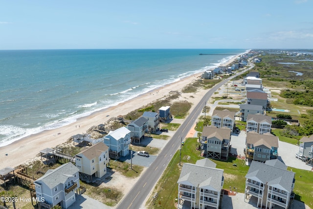 bird's eye view featuring a water view and a view of the beach