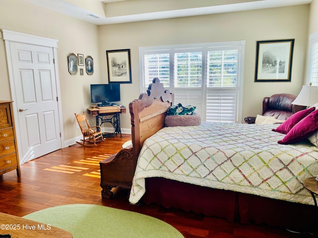 bedroom featuring wood-type flooring