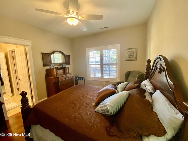 bedroom with hardwood / wood-style flooring and ceiling fan