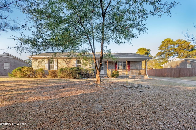 ranch-style home featuring a porch