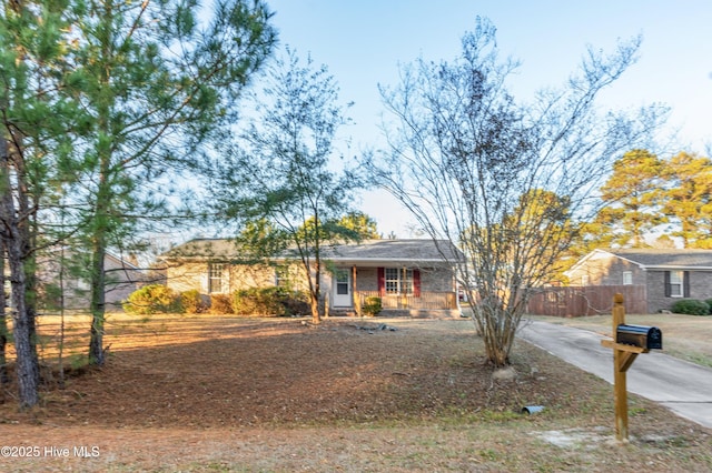 ranch-style house featuring covered porch