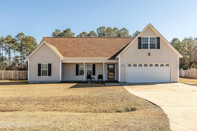 view of front of home with a garage and a front lawn