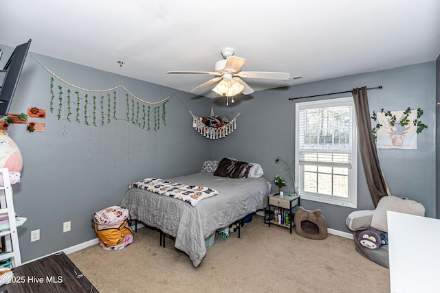 carpeted bedroom with ceiling fan