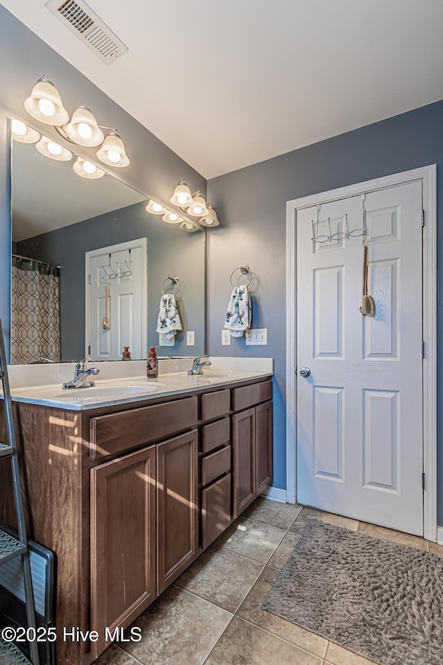 bathroom featuring vanity and tile patterned flooring