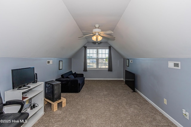 home office with ceiling fan, lofted ceiling, and carpet