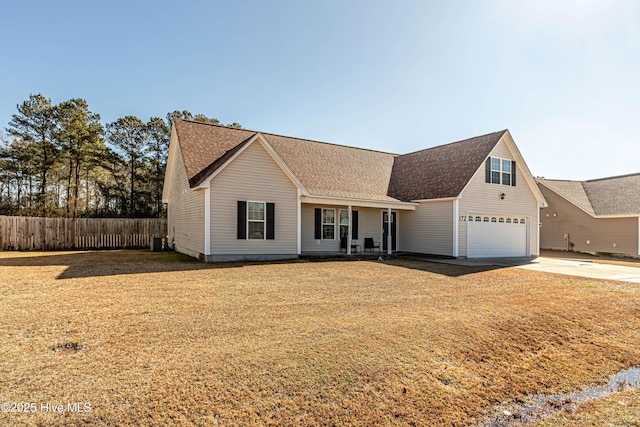 view of front of property with a garage and central air condition unit