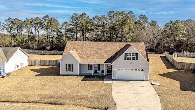 view of front facade with a garage, a front lawn, and a porch