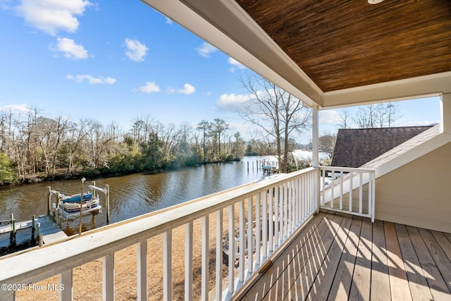 exterior space with a dock and a water view