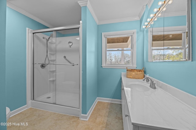 bathroom featuring ornamental molding, vanity, and a shower with shower door