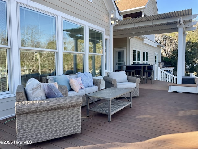 deck featuring outdoor lounge area