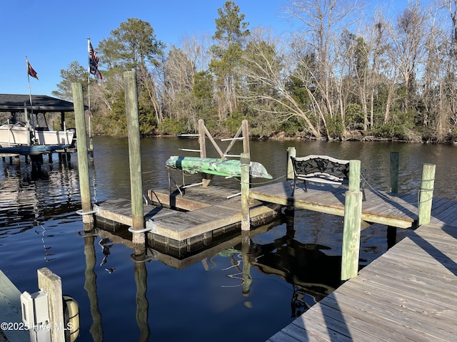 view of dock with a water view