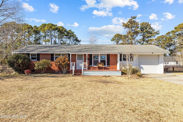 ranch-style house with covered porch, a front lawn, and a garage