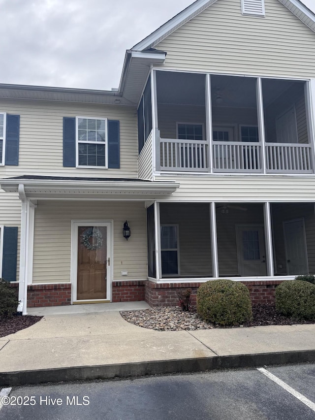 view of front of property with a sunroom