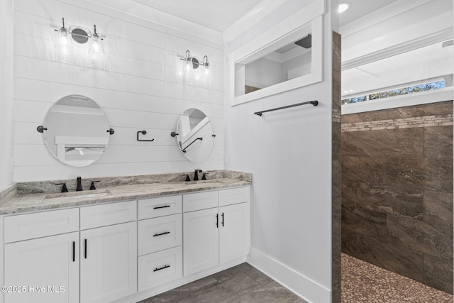 bathroom with walk in shower and vanity