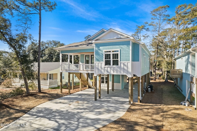 view of front of house featuring a carport and covered porch