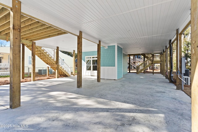 view of patio / terrace with central AC and a carport