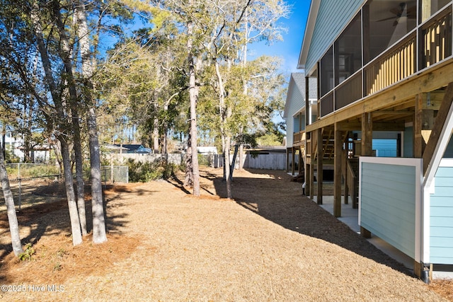 view of yard with ceiling fan