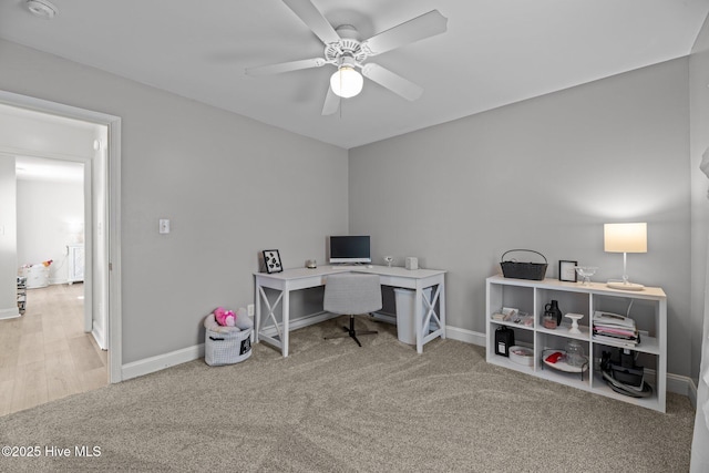 carpeted office with ceiling fan