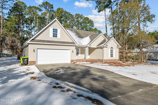 view of front of property with a garage