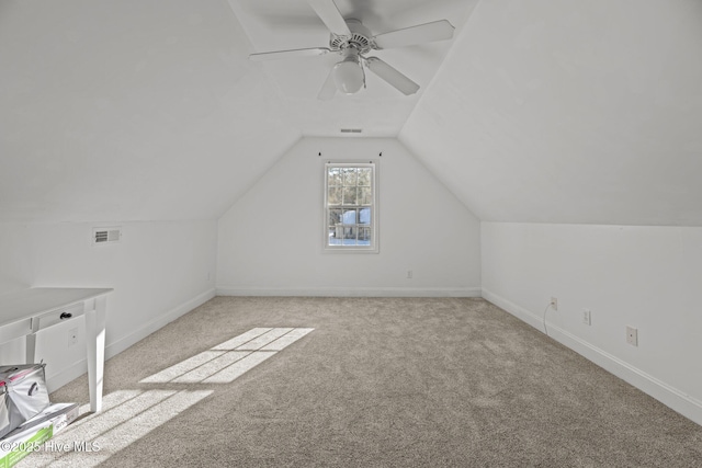 additional living space with lofted ceiling, light colored carpet, and ceiling fan